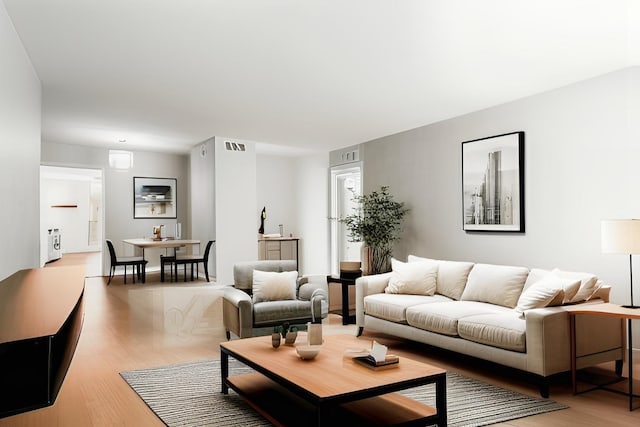 living room featuring baseboards and wood finished floors