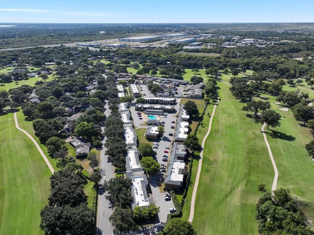 aerial view of property's location featuring a local golf course
