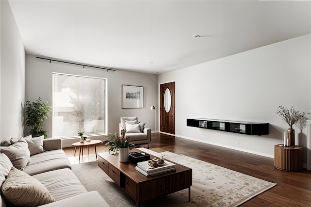 unfurnished living room featuring baseboards, visible vents, and dark wood finished floors