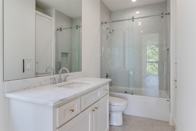 bathroom featuring vanity, ceiling fan, wood-type flooring, and an enclosed shower