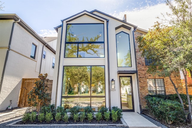 view of front of home featuring brick siding