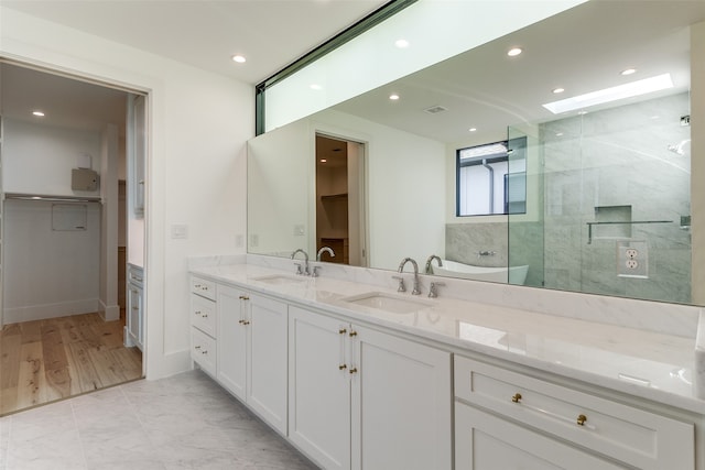 spacious closet featuring light wood-type flooring