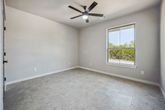 spare room with ceiling fan