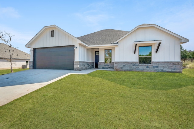 modern inspired farmhouse with a front yard, central AC unit, and a garage