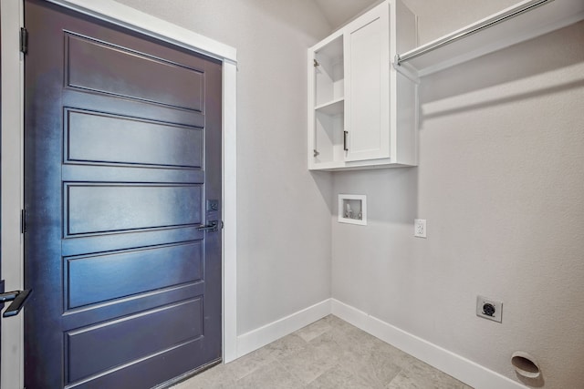 washroom featuring hookup for an electric dryer, washer hookup, and cabinets