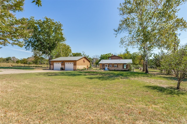 view of yard featuring a garage