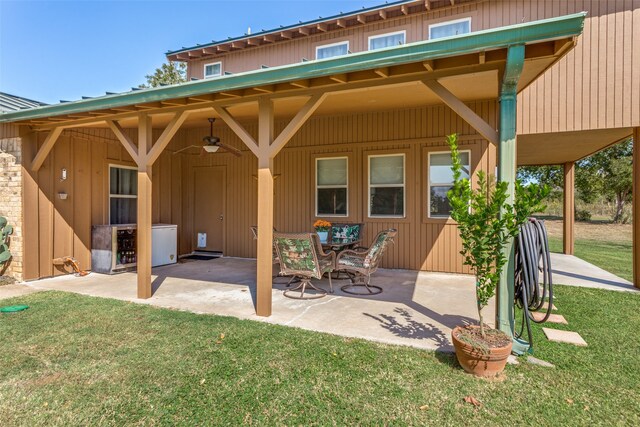 back of house with a patio, a lawn, and ceiling fan