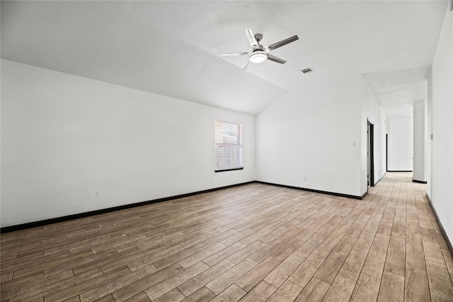 spare room featuring ceiling fan and lofted ceiling