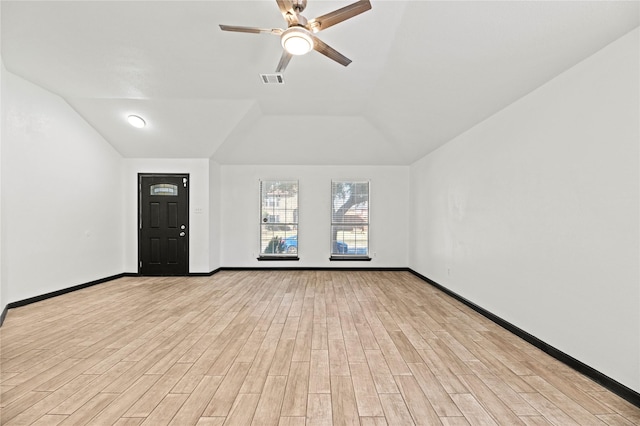 unfurnished living room with ceiling fan, lofted ceiling, and light wood-type flooring