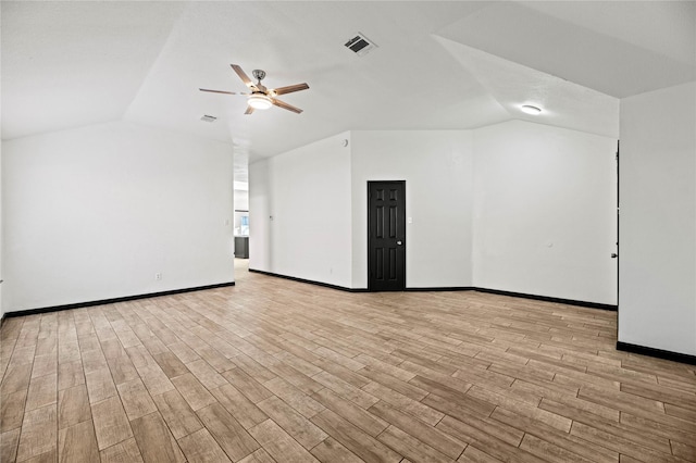 interior space featuring ceiling fan and vaulted ceiling