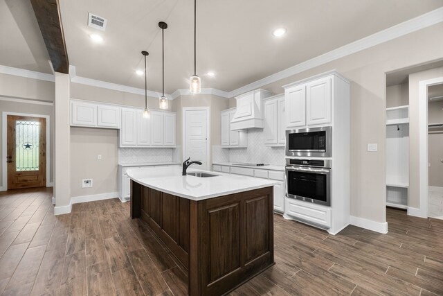 2201 Crystal Palace Blvd, Alvarado, TX 76009 - kitchen with a sink, visible vents, light countertops, appliances with stainless steel finishes, and custom range hood