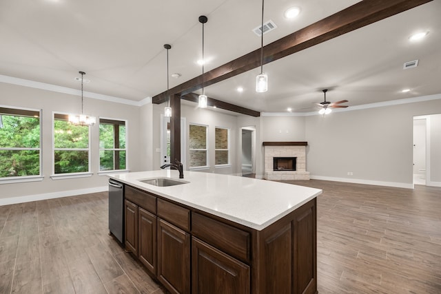 2201 Crystal Palace Blvd, Alvarado, TX 76009 - kitchen with a fireplace, visible vents, a sink, and ceiling fan with notable chandelier