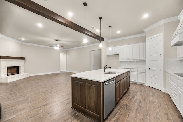 2201 Crystal Palace Blvd, Alvarado, TX 76009 - kitchen featuring a sink, stainless steel dishwasher, light countertops, and a ceiling fan