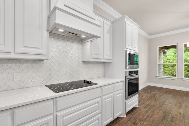 2201 Crystal Palace Blvd, Alvarado, TX 76009 - kitchen featuring baseboards, ornamental molding, custom range hood, white cabinetry, and stainless steel appliances