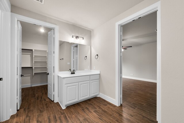 2201 Crystal Palace Blvd, Alvarado, TX 76009 - bathroom with a ceiling fan, baseboards, wood finished floors, and vanity