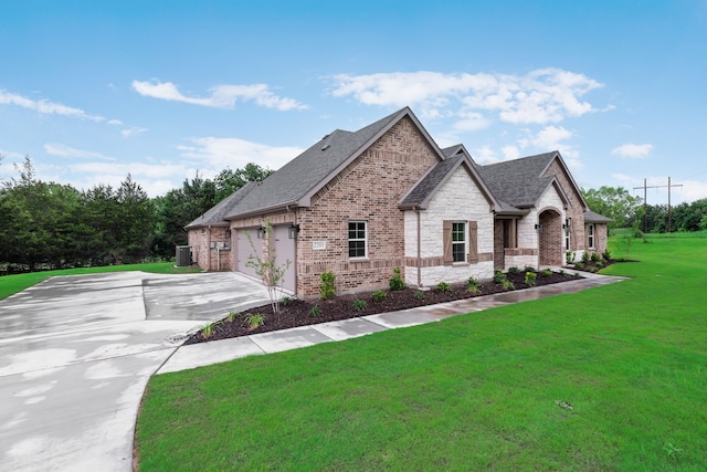 2201 Crystal Palace Blvd, Alvarado, TX 76009 - french provincial home featuring concrete driveway, a shingled roof, brick siding, and a front lawn