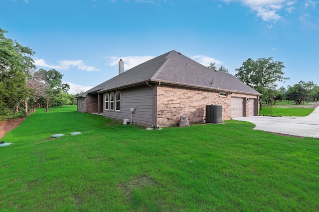 2201 Crystal Palace Blvd, Alvarado, TX 76009 - view of property exterior featuring cooling unit, a chimney, a lawn, brick siding, and driveway