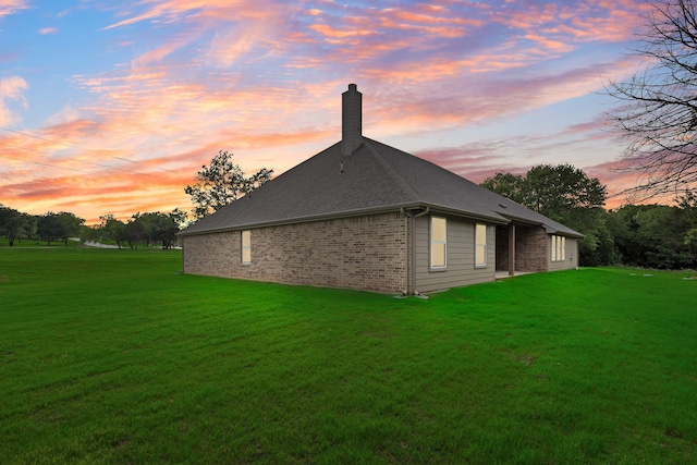 2201 Crystal Palace Blvd, Alvarado, TX 76009 - rear view of property featuring a chimney, brick siding, a shingled roof, and a lawn