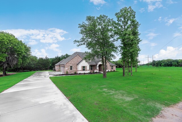 2201 Crystal Palace Blvd, Alvarado, TX 76009 - french country style house with driveway and a front yard
