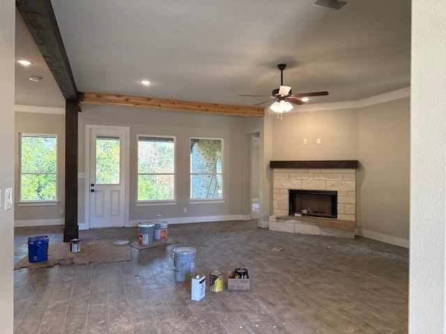 unfurnished living room with ornamental molding, wood-type flooring, and a fireplace