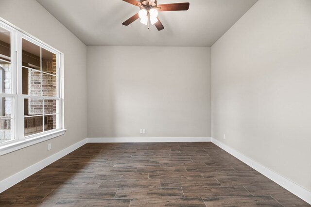 2201 Crystal Palace Blvd, Alvarado, TX 76009 - spare room featuring baseboards, ceiling fan, and dark wood-type flooring