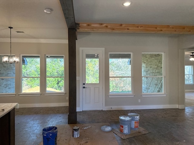 doorway to outside with crown molding, plenty of natural light, and a chandelier