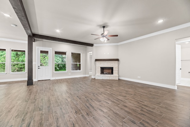 2201 Crystal Palace Blvd, Alvarado, TX 76009 - unfurnished living room featuring baseboards, a ceiling fan, a healthy amount of sunlight, and wood finished floors