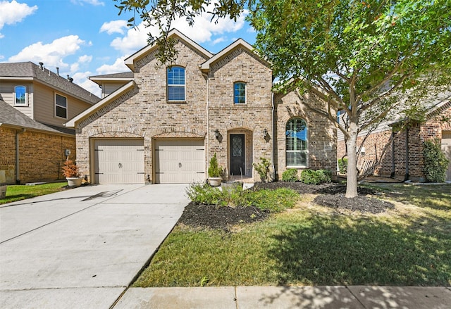 view of front facade with a front yard and a garage