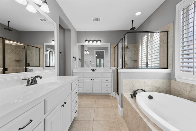 bathroom featuring vanity, separate shower and tub, and tile patterned flooring