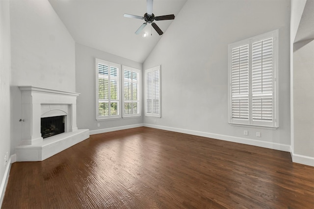 unfurnished living room featuring ceiling fan, high vaulted ceiling, and dark hardwood / wood-style flooring