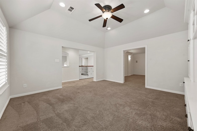 unfurnished living room featuring carpet floors, high vaulted ceiling, and ceiling fan