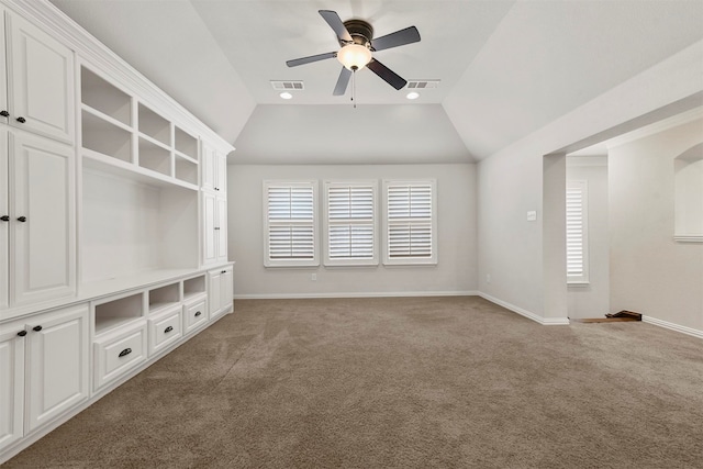 unfurnished living room featuring lofted ceiling, carpet flooring, and ceiling fan