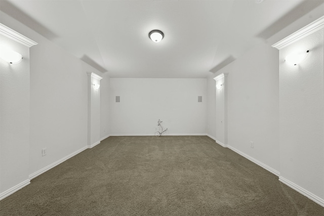 unfurnished room featuring dark colored carpet