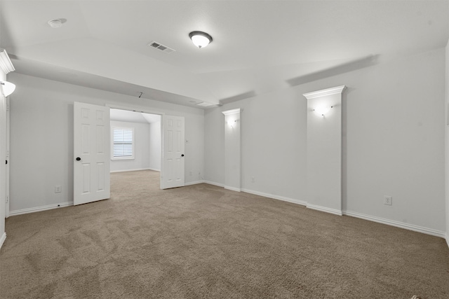 empty room with carpet flooring and lofted ceiling