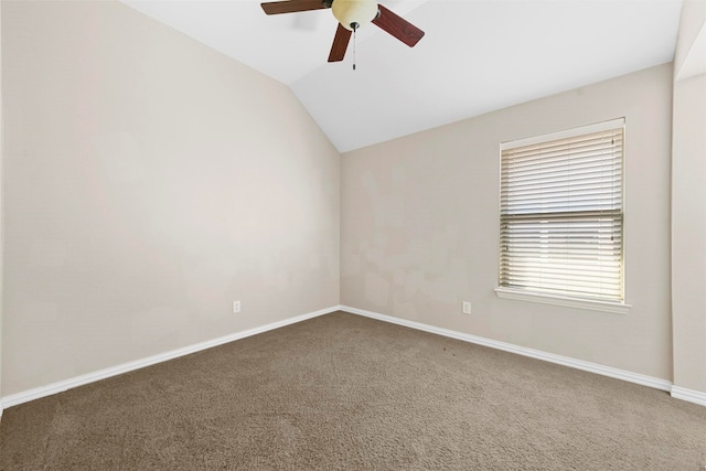 spare room featuring vaulted ceiling, carpet floors, and ceiling fan