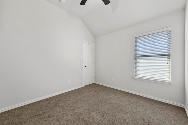 spare room featuring ceiling fan, carpet, and vaulted ceiling