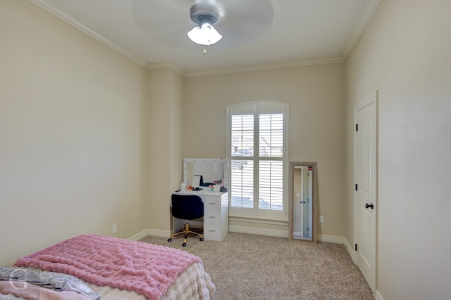 bedroom featuring crown molding, light colored carpet, and ceiling fan