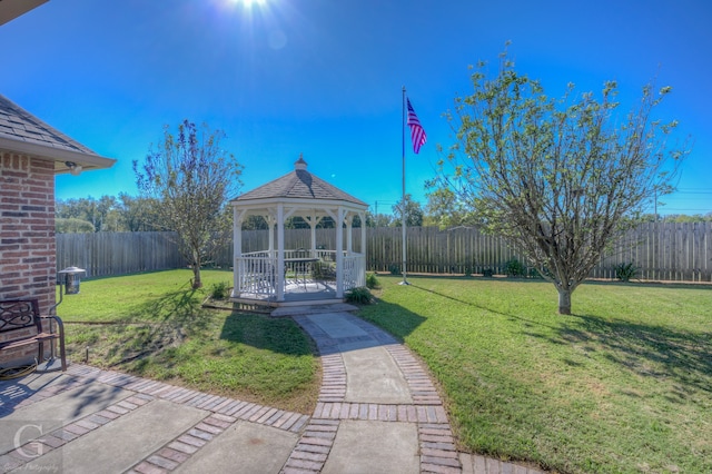 exterior space with a gazebo and a lawn