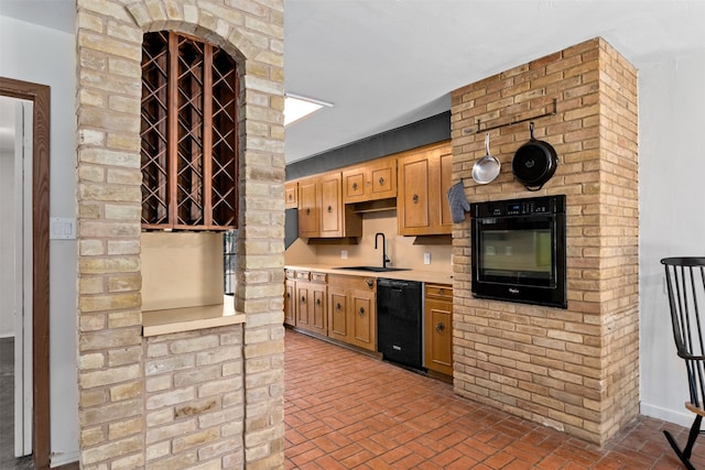 kitchen with black appliances and sink