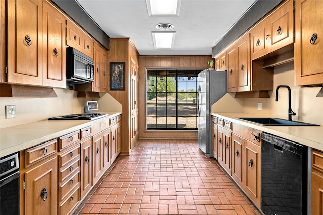 kitchen with sink and black appliances