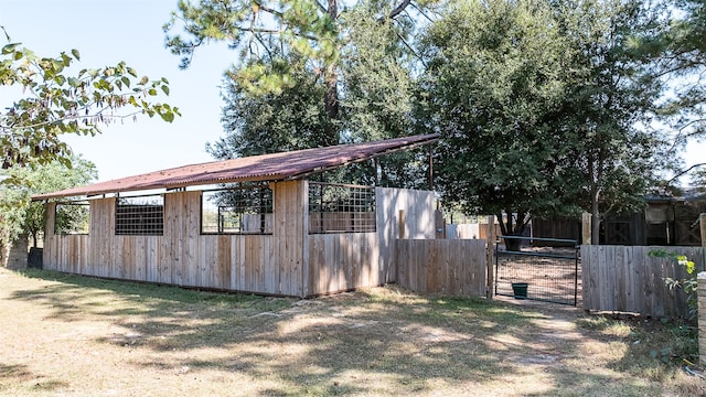 view of property exterior featuring an outbuilding