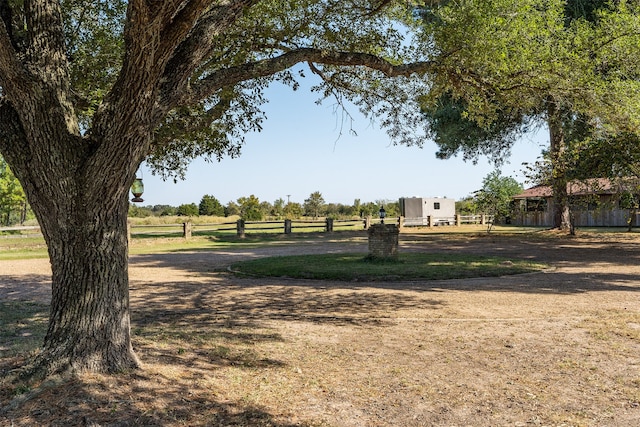 view of yard with a rural view