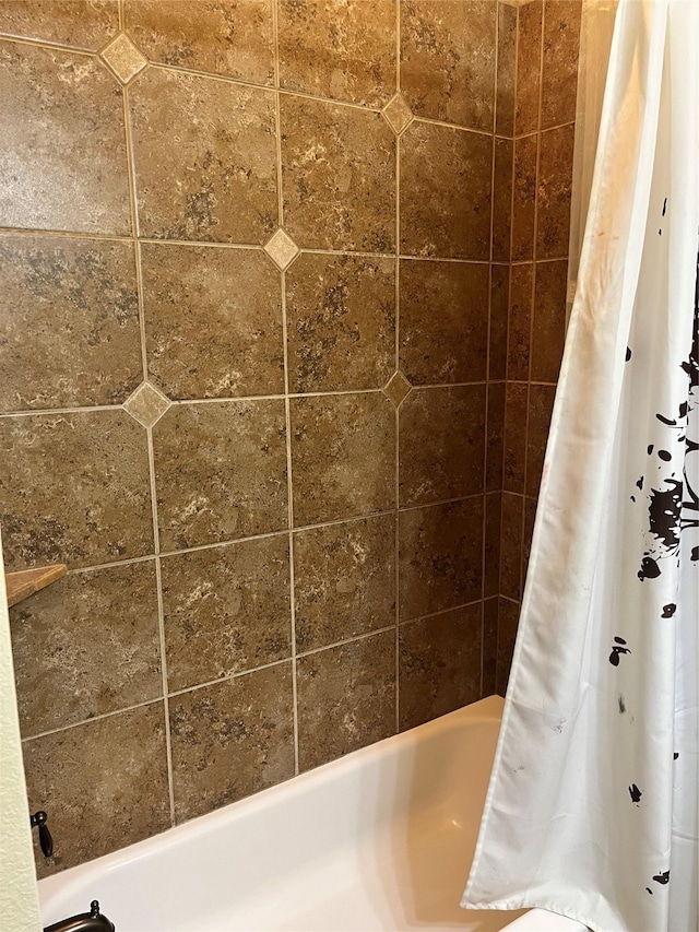 bathroom with shower / bath combination with curtain