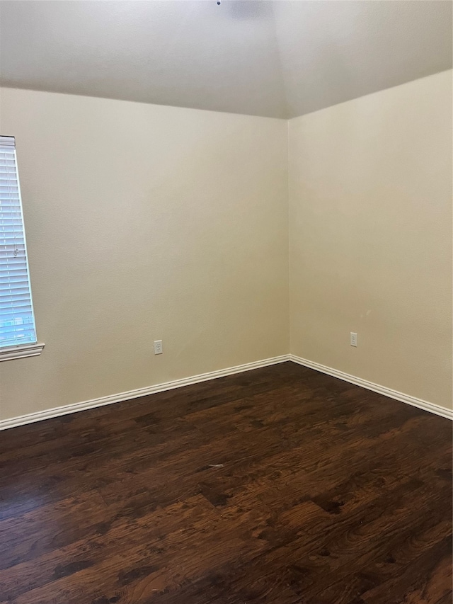 spare room featuring dark hardwood / wood-style flooring