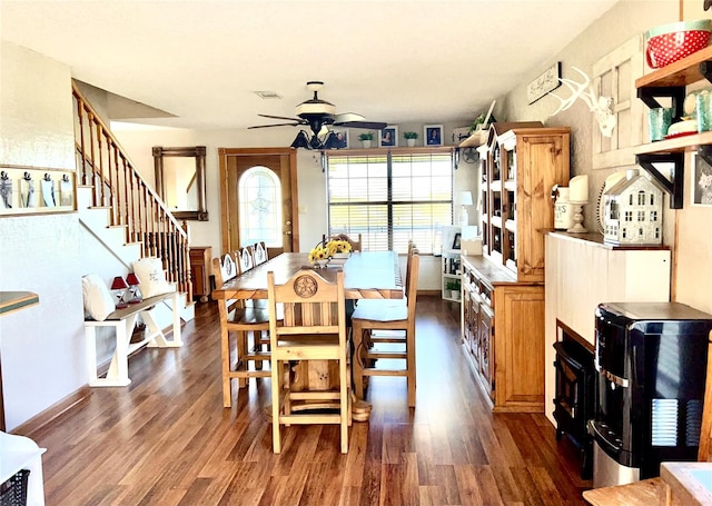 dining area with ceiling fan and dark hardwood / wood-style flooring