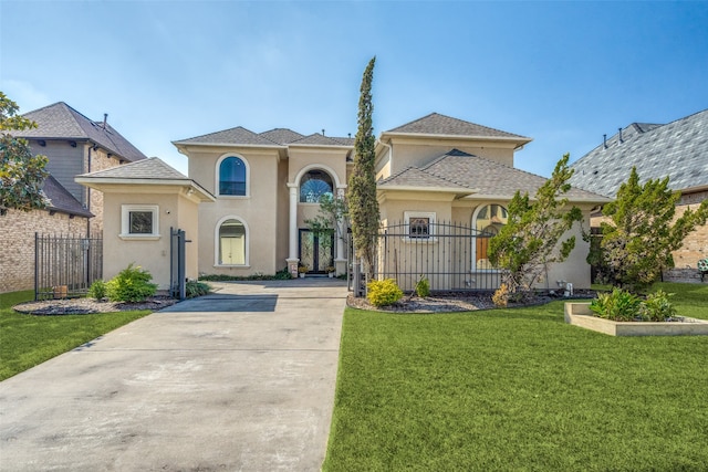 mediterranean / spanish-style house with a front yard