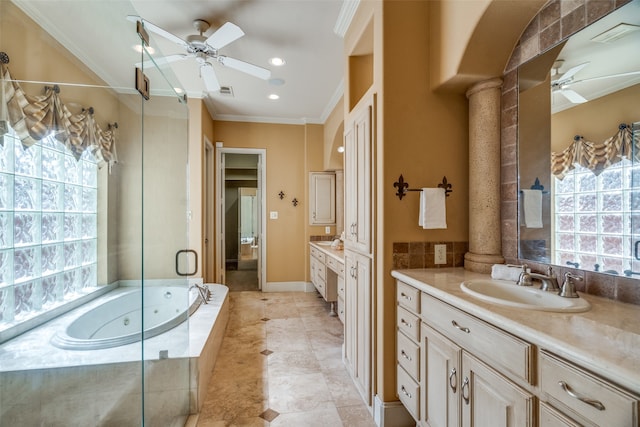 bathroom with vanity, decorative columns, ornamental molding, and plenty of natural light