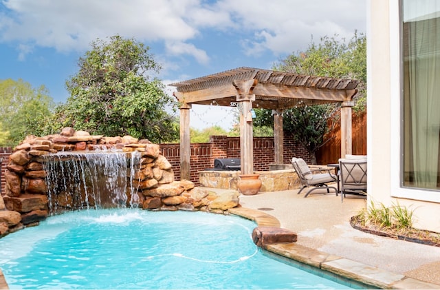 view of pool featuring area for grilling, a patio area, pool water feature, and a pergola