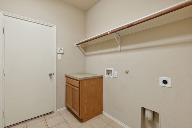 washroom featuring hookup for an electric dryer, hookup for a washing machine, gas dryer hookup, and light tile patterned floors