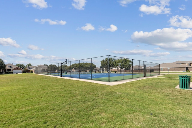 exterior space featuring a lawn and tennis court